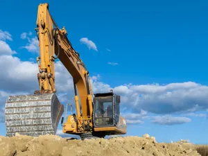 Excavator moving earth on a job site