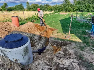 Trench dug and pipe laid for a septic field